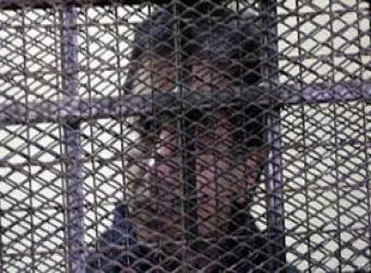 احمد عز خلف القضبان